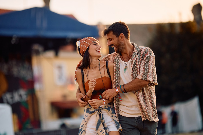 A couple walking through their neighbourhood