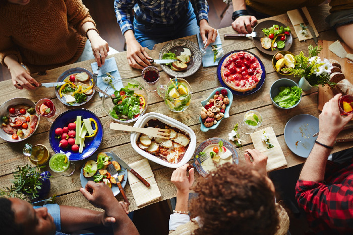 Friends sharing a table of good food